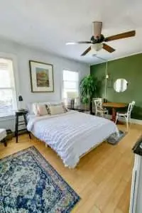 a room with a green accent wall.